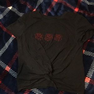 Black shirt w roses.